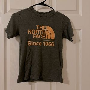 The north face. Kids shirt. Size s 7-8. Green